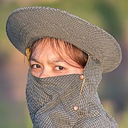 Portrait of a young woman wearing a gray balaclava.jpg